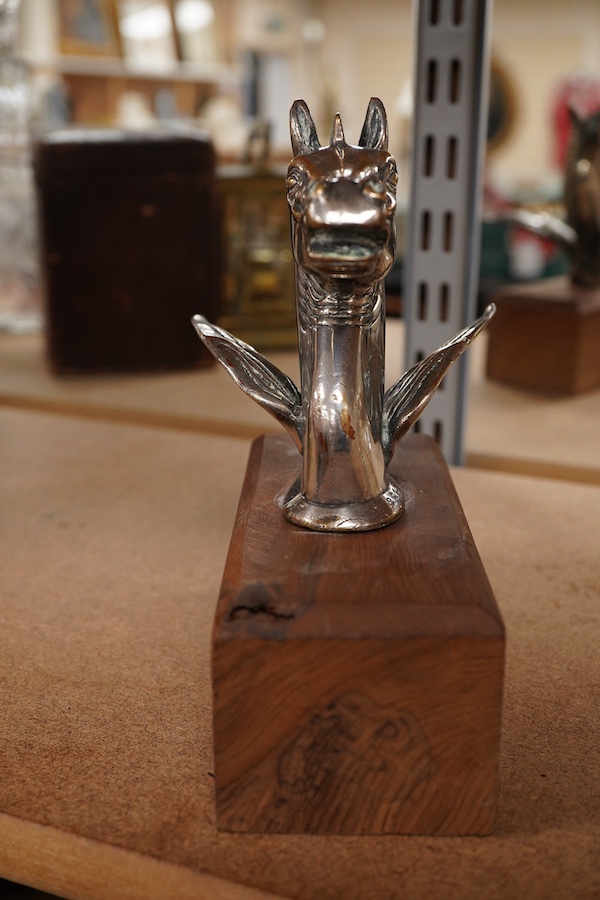 A silver plated Pegasus horse's head car mascot, signed D.G. Yeo, dated 1924, mounted on a wooden plinth